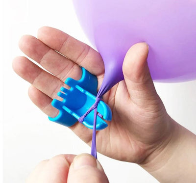 Balloon tie tool in a hand