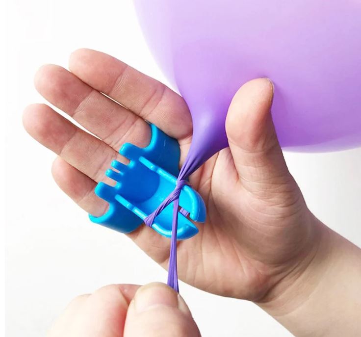 Balloon tie tool in a hand